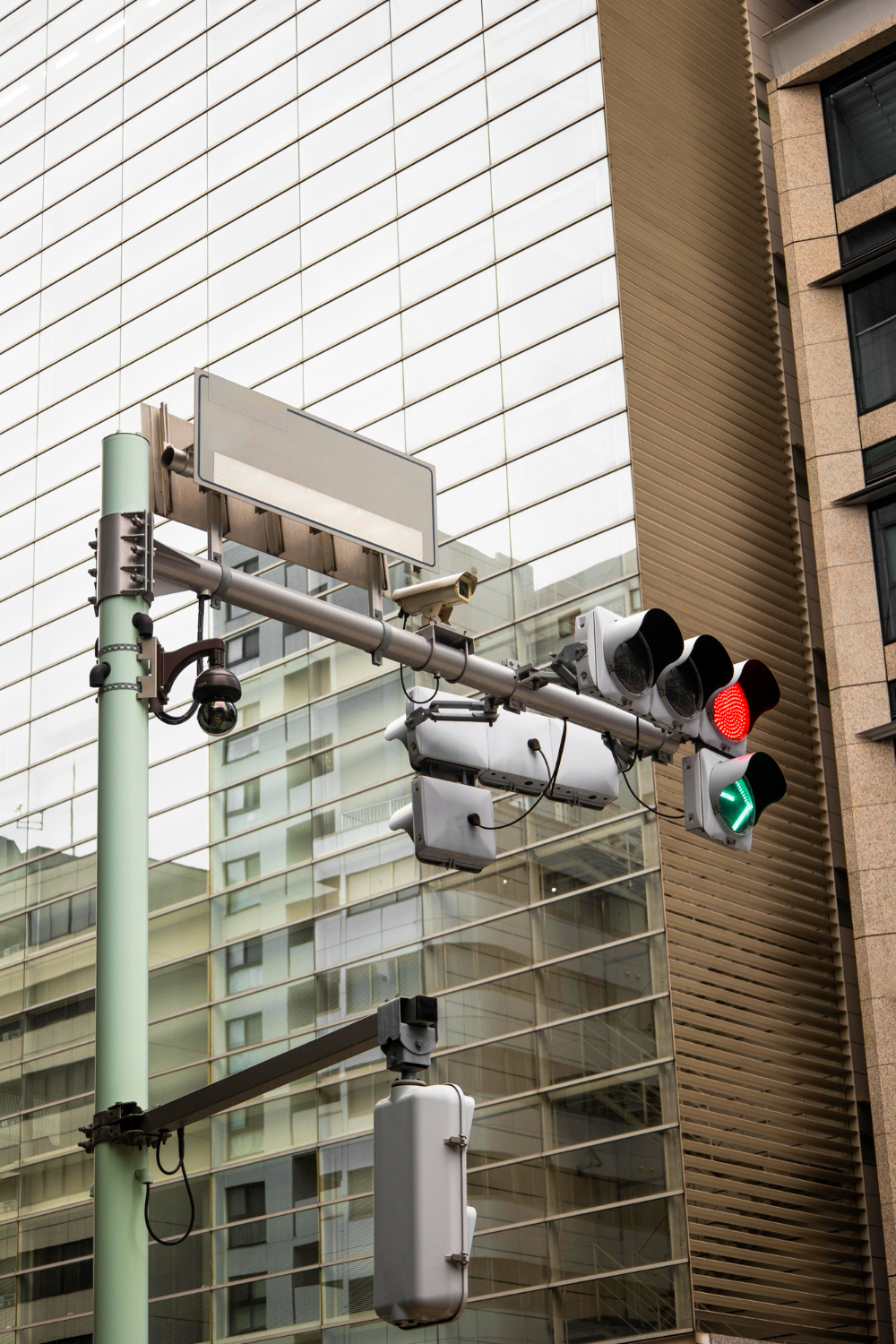 Traffic light pole equipped with surveillance cameras and wireless access point in an urban smart city setting